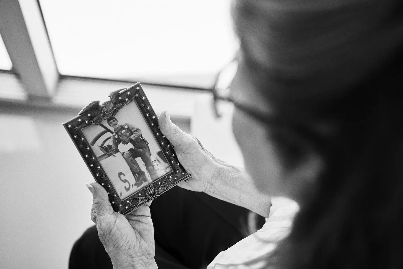 Patricia with a photo of her brother Michael, who was killed in Vietnam