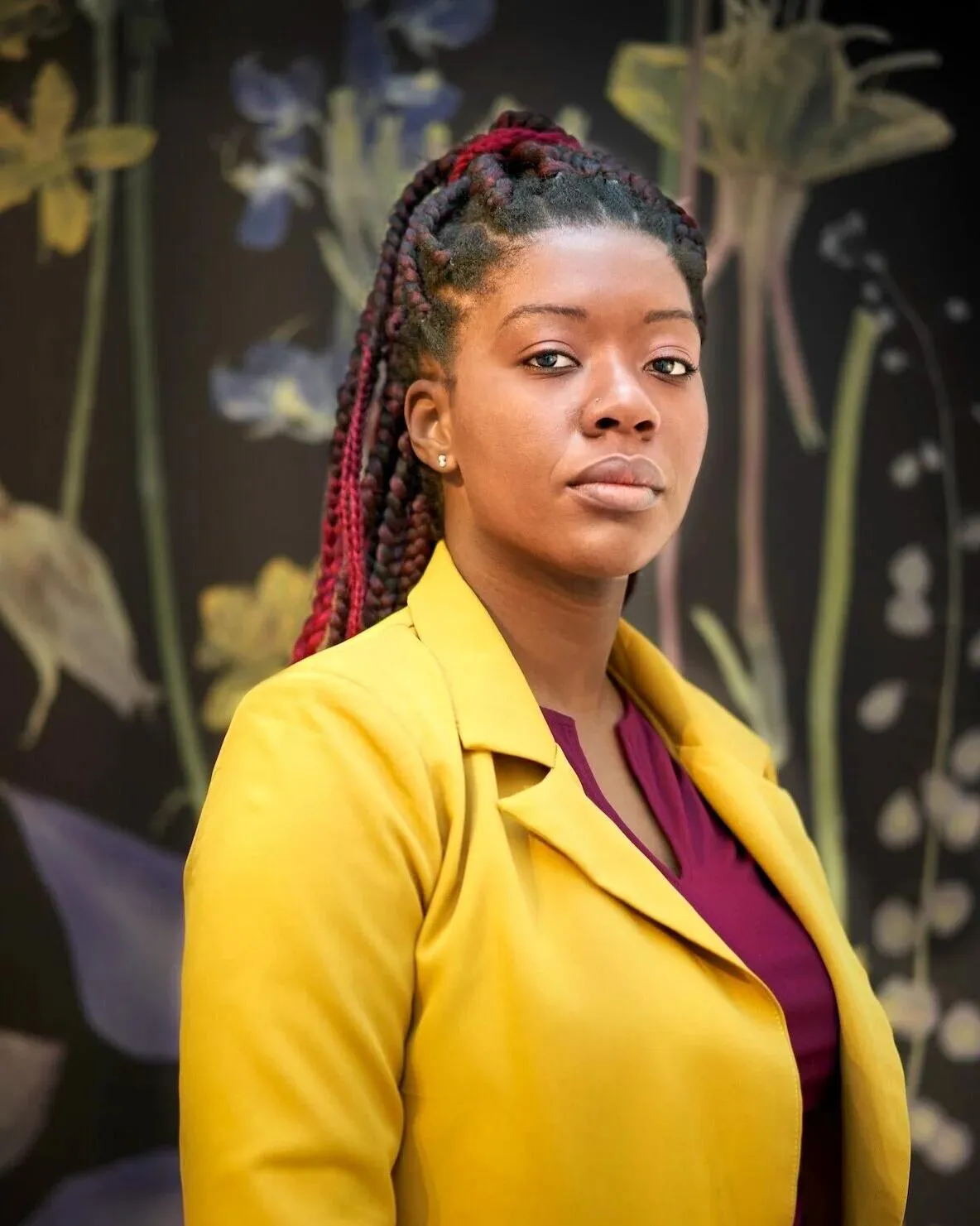 Georgie decided to embrace her love of color, her natural hair and her serious, “I mean business” self in her shoot.